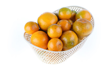orange fruit in basket, isolated on white background