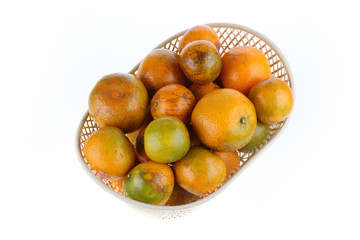 orange fruit in basket, isolated on white background