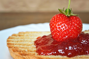 Fresh strawberry and strawberry jam on toast