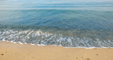Fototapeta na wymiar Beautiful white sand beach and tropical turquoise blue sea. View