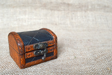 Wooden chest on canvas background