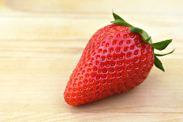 Fresh strawberry on wooden background