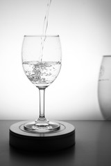 Water is poured into a glass