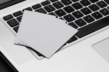 Business cards spread on computer keybaord