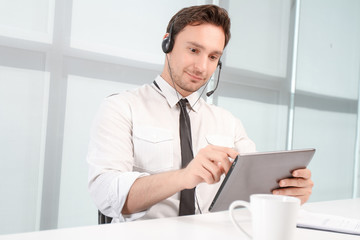 Fototapeta premium Call center operator holding laptop