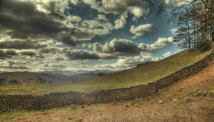 Dry stone wall and clouds