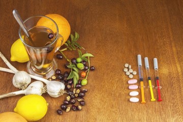 Rosehip tea and flu vaccination. Traditional medicine and modern treatment methods. Injection of influenza vaccine. Household treatment of flu and colds.
