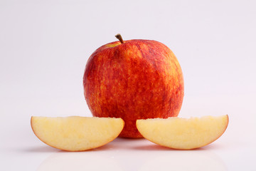 Cool organic fresh red apple sliced isolated on white