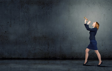 Woman speaking in horn