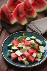 Salad with watermelon, cucumber and bryndza cheese, close-up