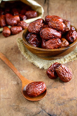 Dried jujube fruits on wooden table