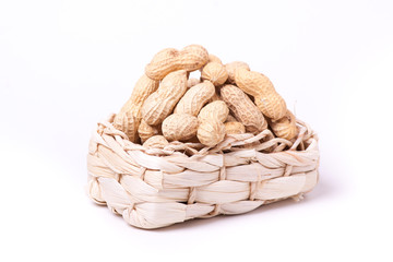 peanuts isolated in basket on white background