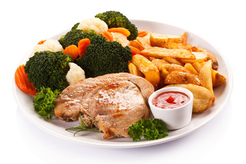 Steak, baked potatoes and vegetables 