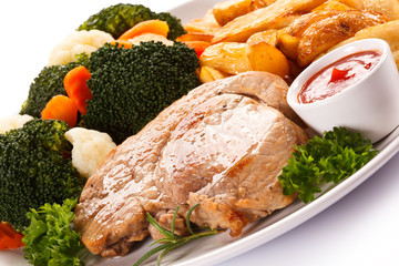 Steak, baked potatoes and vegetables 