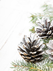 Christmas background with decoration with cones and twigs 