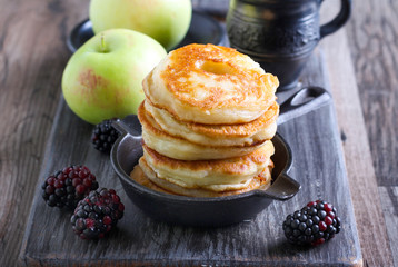 Pile of apple fritters in a pan © manyakotic