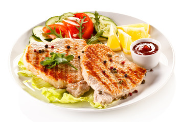 Grilled steaks and vegetable salad 