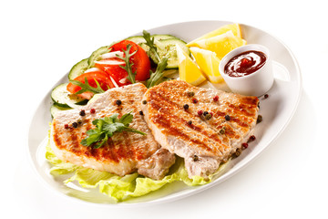 Grilled steaks and vegetable salad 