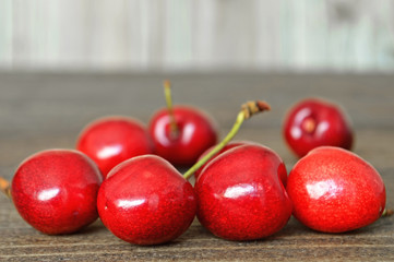 Sweet cherries on wooden background