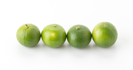 green lemon isolated on white background