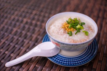 rice gruel in bowl on tablecloth in morning