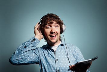 Closeup portrait surprised funny looking young hipster man