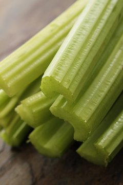 fresh cellery sticks on slate background