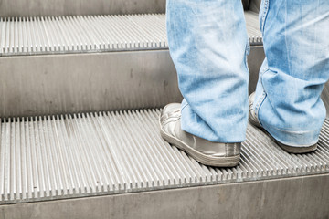 Man's foot on escalator