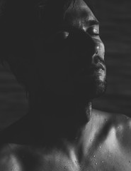 Dark atmospheric portrait of a relaxed man