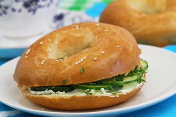 Bagel with cream cheese and cucumber
