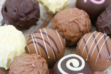 Assorted milk, white and dark chocolates, close up
