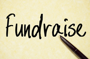 fundraise word write on paper