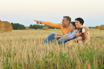 Happy family in wheat field