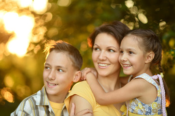 Fototapeta premium Mother with kids on the field
