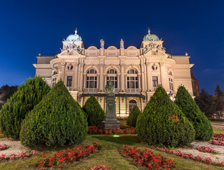 Fototapeta na wymiar Juliusz Slowacki theatre in Krakow, Poland. Night view of illuminated XIXth century building, built in eclectic style.