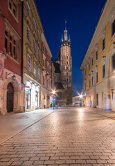 Night view of Florianska street - part of Royal Way (Droga Krolewska) in old town of Krakow, Poland