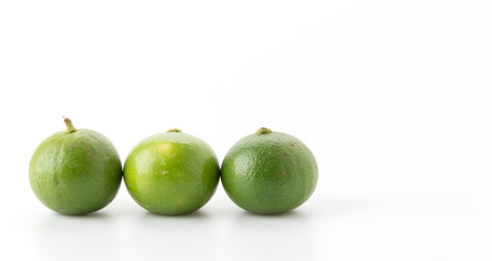 green lemon isolated on white background