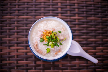 rice gruel in bowl on tablecloth in morning