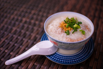 rice gruel in bowl on tablecloth in morning