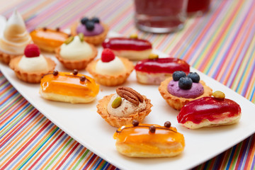 Set of small cakes on plate