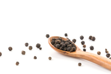 Black pepper with wood spoon