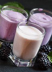 Homemade yogurt and milk cocktail with berry blackberries, selec