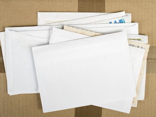 a pile of letters and postal parcel