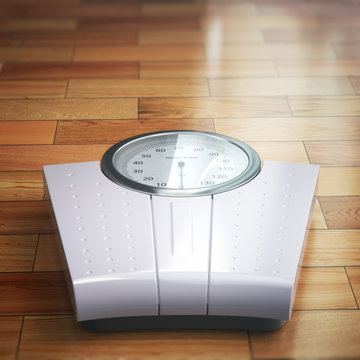 Weight scale on the wooden floor. Space for text.