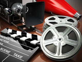 Naklejka premium Video, movie, cinema vintage concept. Retro camera, reels and cl