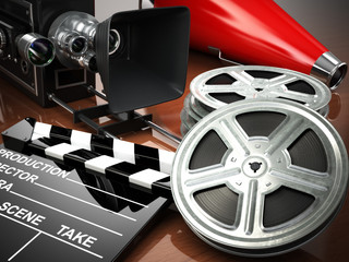 Fototapeta premium Video, movie, cinema vintage concept. Retro camera, reels and cl