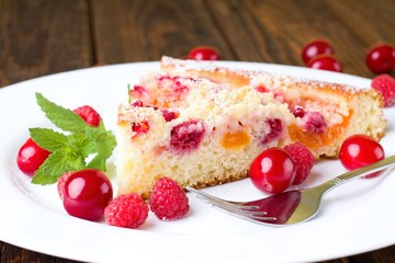 Fresh single portion of fruit pie on white plate