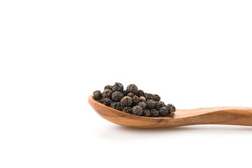 Black pepper with wood spoon