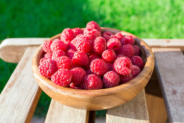 Fresh organic fruit - raspberry on wood