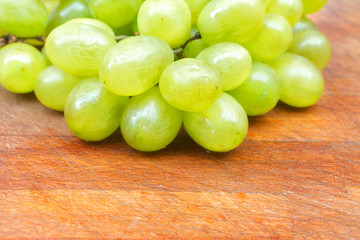 Grapes on wooden table